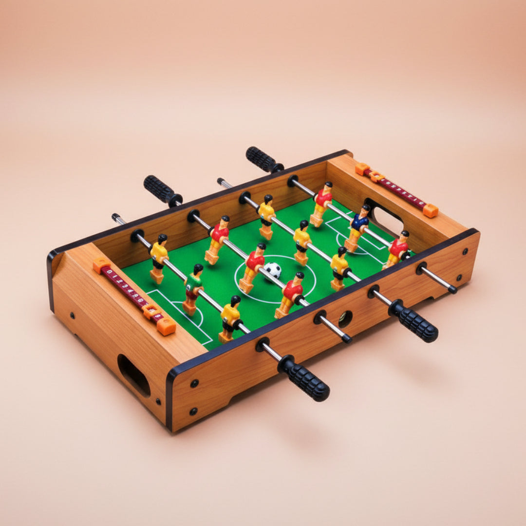 Tabletop soccer game with colorful players on a brown background