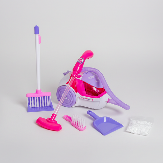 Toy cleaning set with broom, vacuum, and cleaning tools on a flat surface